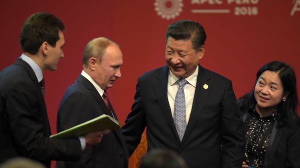 Russia's President Vladimir Putin (2nd L) and China's President Xi Jinping (2nd R) chat after shaking hands at the start of the ABAC and APEC Leaders' Dialogue at the Asia-Pacific Economic Cooperation Summit in Lima on November 19, 2016. Russia's President Vladimir Putin (2nd L) and China's President Xi Jinping (2nd R) chat after shaking hands at the start of the ABAC and APEC Leaders' Dialogue at the Asia-Pacific Economic Cooperation Summit in Lima on November 19, 2016. - Sputnik International