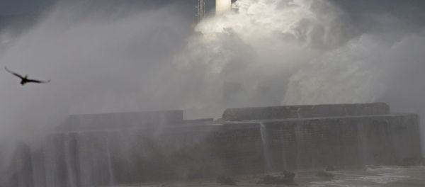 Waves crash against a lighthouse as the wind blows at around 120 kph (75mph), in Boulogne-sur-Mer, northern France Waves crash against a lighthouse as the wind blows at around 120 kph (75mph), in Boulogne-sur-Mer, northern France - Sputnik International