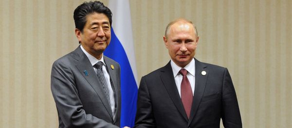 Russian President Vladimir Putin and Japanese Prime Minister Shinzo Abe, left, during a meeting on the sidelines of the APEC Leaders' Meeting in Lima Russian President Vladimir Putin and Japanese Prime Minister Shinzo Abe, left, during a meeting on the sidelines of the APEC Leaders' Meeting in Lima - Sputnik International