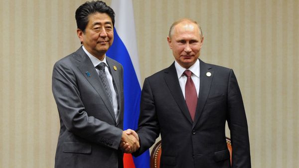 Russian President Vladimir Putin and Japanese Prime Minister Shinzo Abe, left, during a meeting on the sidelines of the APEC Leaders' Meeting in Lima Russian President Vladimir Putin and Japanese Prime Minister Shinzo Abe, left, during a meeting on the sidelines of the APEC Leaders' Meeting in Lima - Sputnik International