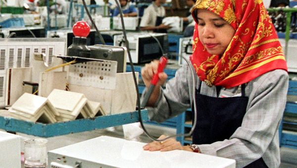 A Malaysian girl working on the production line at the Samsung microwave oven plant in Port Klang A Malaysian girl working on the production line at the Samsung microwave oven plant in Port Klang - Sputnik International