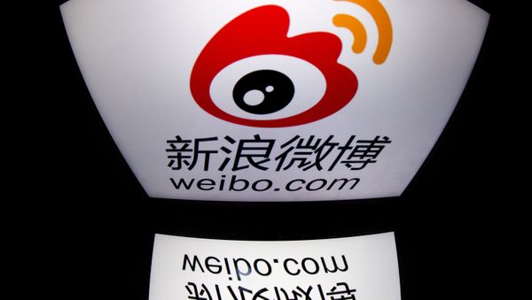 The chinese app Weibo's logo is displayed on a tablet in Paris. (File) - Sputnik International