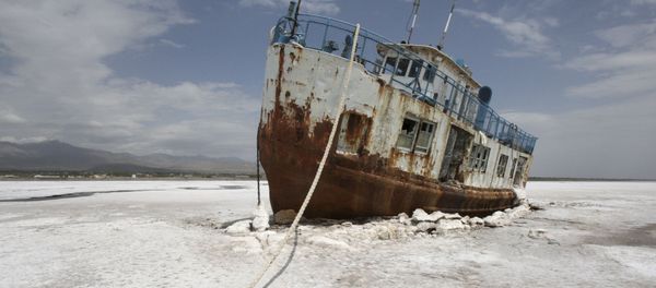 FILE - In this Friday, April 29, 2011 file photo, an abandoned ship is stuck in the solidified salts of the Oroumieh Lake, Iran. - Sputnik International
