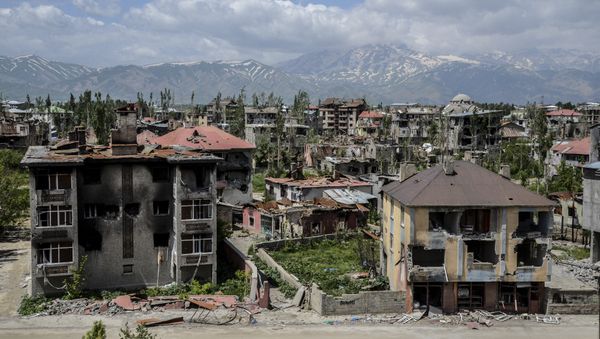 General view of damaged buildings after heavy fightings between Turkish government troops and Kurdish fighters after the curfew in the southeastern Turkey Kurdish town of Yuksekova, near the border with Iraq and Iran. (File) - Sputnik International