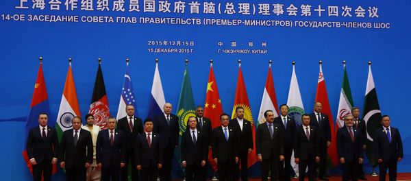 Russian Prime Minister Dmitry Medvedev, first row fifth left, during joint photo opportunity with SCO heads of government and heads of delegations of observer states. (File) Russian Prime Minister Dmitry Medvedev, first row fifth left, during joint photo opportunity with SCO heads of government and heads of delegations of observer states. (File) - Sputnik International