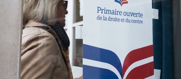 A woman near a polling station in Paris during the first round of the French center-right presidential primary election. An opposition candidate for the 2017 presidential election will be selected during the event A woman near a polling station in Paris during the first round of the French center-right presidential primary election. An opposition candidate for the 2017 presidential election will be selected during the event - Sputnik International