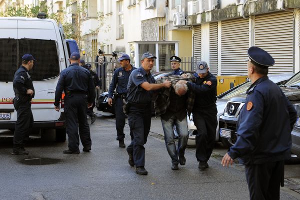 A man is escorted by Montenegrin police officers to the special court in Podgorica on October 16, 2016 A man is escorted by Montenegrin police officers to the special court in Podgorica on October 16, 2016 - Sputnik International