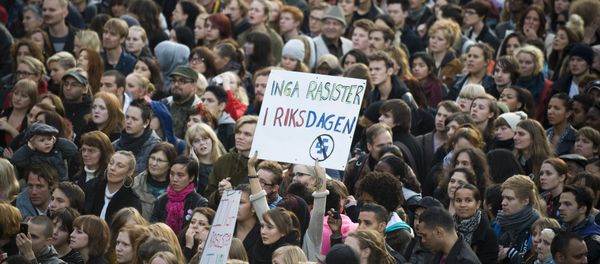 Anti-racist protestors hold a banner reading No Racist In The Parliament during a demo held at Sergels Torg in Stockholm (File) Anti-racist protestors hold a banner reading No Racist In The Parliament during a demo held at Sergels Torg in Stockholm (File) - Sputnik International