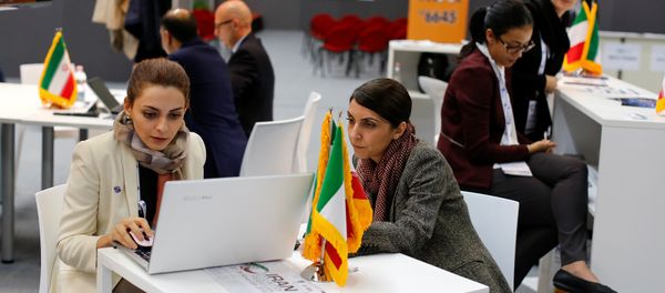 Iranian exhibitors sit in a pavilion during the opening of the fair Iran country presentation in Rome, Italy November 22, 2016 Iranian exhibitors sit in a pavilion during the opening of the fair Iran country presentation in Rome, Italy November 22, 2016 - Sputnik International