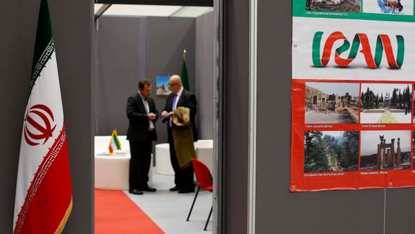 Iranian exhibitors stand in a booth during the opening of the fair Iran country presentation in Rome, Italy November 22, 2016 Iranian exhibitors stand in a booth during the opening of the fair Iran country presentation in Rome, Italy November 22, 2016 - Sputnik International