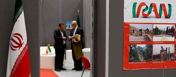 Iranian exhibitors stand in a booth during the opening of the fair Iran country presentation in Rome, Italy November 22, 2016 - Sputnik International