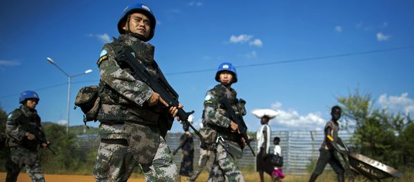 Peacekeeping troops from China, deployed by the United Nations Mission in South Sudan (UNMISS), patrol outside the premises of the UN Protection of Civilians (PoC) site in Juba on October 4, 2016 - Sputnik International