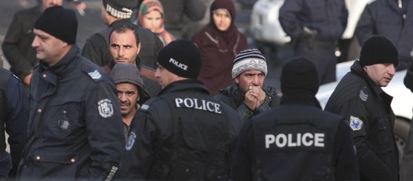 Migrants are seen in front of Bulgarian police after clashes inside a refugee center in the town of Harmanli, Bulgaria, November 25, 2016 Migrants are seen in front of Bulgarian police after clashes inside a refugee center in the town of Harmanli, Bulgaria, November 25, 2016 - Sputnik International