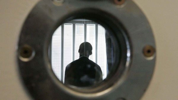 A security guard is seen through a small security window, in a room in the long-term wing at the new Colnbrook Immigration Removal Centre near London's Heathrow Airport, Thursday Sept. 16, 2004 A security guard is seen through a small security window, in a room in the long-term wing at the new Colnbrook Immigration Removal Centre near London's Heathrow Airport, Thursday Sept. 16, 2004 - Sputnik International