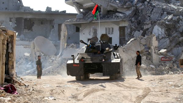 Fighters of Libyan forces allied with the U.N.-backed government take position near the front line of fighting with Islamic State militants in Ghiza Bahriya district in Sirte, Libya November 22, 2016. - Sputnik International