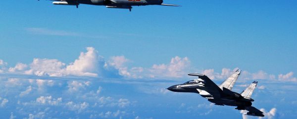 Chinese People's Liberation Army Air Force Su-30 fighter, right, flies along with a H-6K bomber as they take part in a drill near the East China Sea (File) Chinese People's Liberation Army Air Force Su-30 fighter, right, flies along with a H-6K bomber as they take part in a drill near the East China Sea (File) - Sputnik International