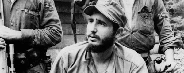FILE - In this March 14, 1957 file photo, Fidel Castro, the young anti-Batista guerrilla leader, center, is seen with his brother Raul Castro, left, and Camilo Cienfuegos, right, while operating in the Mountains of Eastern Cuba. The man who nationalized the Cuban economy and controlled of virtually every aspect of life on the island celebrates his 90th birthday on Saturday - Sputnik International