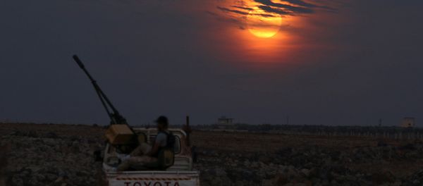 A Free Syrian army fighter sits on a pick-up truck mounted with a weapon, as the supermoon partly covered by clouds is seen in the background, in the west of the rebel-held town of Dael, in Deraa Governorate, Syria November 14, 2016 A Free Syrian army fighter sits on a pick-up truck mounted with a weapon, as the supermoon partly covered by clouds is seen in the background, in the west of the rebel-held town of Dael, in Deraa Governorate, Syria November 14, 2016 - Sputnik International