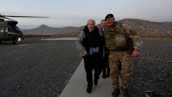 Britain's Foreign Secretary Boris Johnson (L) and Brigadier Ian Rigden, (R) Chief mentor At Afghan National Army Officer Academy arrives during his visits at Camp Qargha in Kabul, Afghanistan November 26, 2016 - Sputnik International