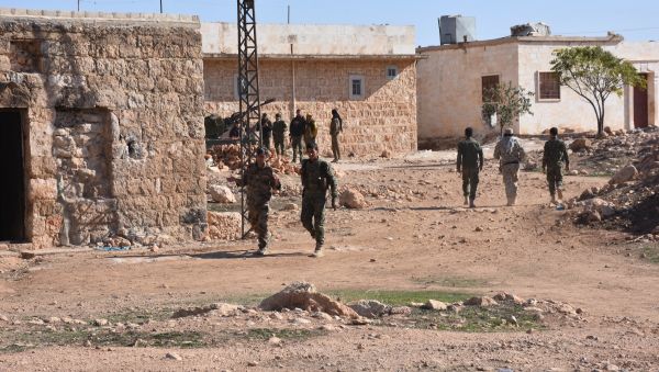 Fighter from the Syrian pro-government forces patrol in the recently recaptured village of Joubah during an offensive advancing towards the area of Al-Bab in Aleppo province, on November 25, 2016 Fighter from the Syrian pro-government forces patrol in the recently recaptured village of Joubah during an offensive advancing towards the area of Al-Bab in Aleppo province, on November 25, 2016 - Sputnik International