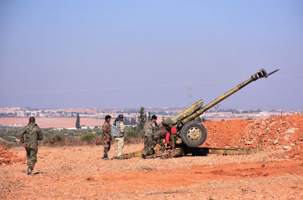 Syrian pro-government fighters fire a Russian 122mm howitzer gun as they advance in the recently recaptured village of Joubah during an offensive towards the area of Al-Bab in Aleppo province, on November 25, 2016 Syrian pro-government fighters fire a Russian 122mm howitzer gun as they advance in the recently recaptured village of Joubah during an offensive towards the area of Al-Bab in Aleppo province, on November 25, 2016 - Sputnik International