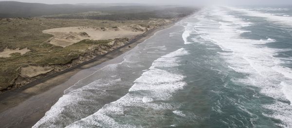 Muriwai beach is seen Sunday, Nov. 27, 2016 after the chartered fishing boat Francie disappeared off Auckland, New Zealand - Sputnik International