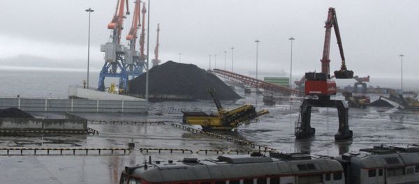 In this July 24, 2016 photo, coal brought from Siberia are be seen awaiting loading onto a ship bound for China in the North Korean special economic zone of Rason In this July 24, 2016 photo, coal brought from Siberia are be seen awaiting loading onto a ship bound for China in the North Korean special economic zone of Rason - Sputnik International
