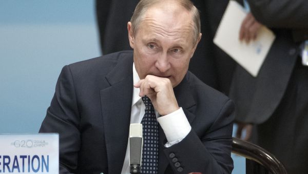 Russian President Vladimir Putin looks on before the start of the opening ceremony of the G20 leaders' family photo in Hangzhou on September 4, 2016 - Sputnik International