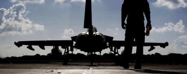 This photo taken on September 22, 2016 shows a British soldier walking by a Eurofighter Typhoon fighter jet at Royal Air Force's Akrotiri base in Cyprus, before taking off for a coalition mission over Iraq. This photo taken on September 22, 2016 shows a British soldier walking by a Eurofighter Typhoon fighter jet at Royal Air Force's Akrotiri base in Cyprus, before taking off for a coalition mission over Iraq. - Sputnik International