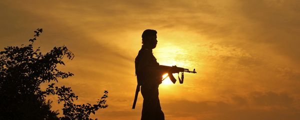 A policeman stands guard outside a police post near Jammu A policeman stands guard outside a police post near Jammu - Sputnik International
