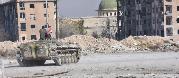 A Syrian government soldier rides a military vehicle near a mosque, after taking control of Aleppo's Al-Haidariya neighbourhood, Syria. (File) A Syrian government soldier rides a military vehicle near a mosque, after taking control of Aleppo's Al-Haidariya neighbourhood, Syria. (File) - Sputnik International