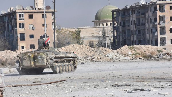 A Syrian government soldier rides a military vehicle near a mosque, after taking control of Aleppo's Al-Haidariya neighbourhood, Syria. (File) A Syrian government soldier rides a military vehicle near a mosque, after taking control of Aleppo's Al-Haidariya neighbourhood, Syria. (File) - Sputnik International