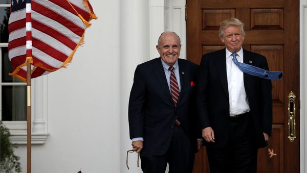 U.S. President-elect Donald Trump stands with former New York City Mayor Rudolph Giuliani before their meeting at Trump National Golf Club in Bedminster, New Jersey, U.S., November 20, 2016 - Sputnik International