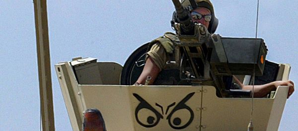 A Norwegian soldier, his armoured vehicle decorated with a Vicking helmet A Norwegian soldier, his armoured vehicle decorated with a Vicking helmet - Sputnik International