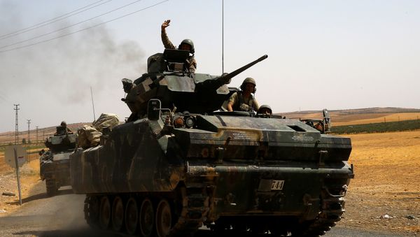 A Turkish soldier on an armoured personnel carrier waves as they drive from the border back to their base in Karkamis on the Turkish-Syrian border in the southeastern Gaziantep province, Turkey, August 27, 2016 A Turkish soldier on an armoured personnel carrier waves as they drive from the border back to their base in Karkamis on the Turkish-Syrian border in the southeastern Gaziantep province, Turkey, August 27, 2016 - Sputnik International