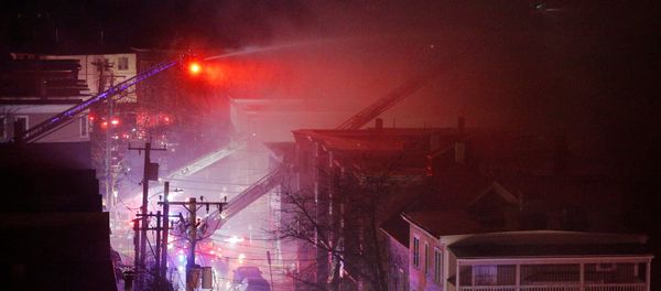 Firefighters battle a multi-alarm fire in a residential area of Cambridge, Massachusetts, U.S., December 3, 2016. - Sputnik International
