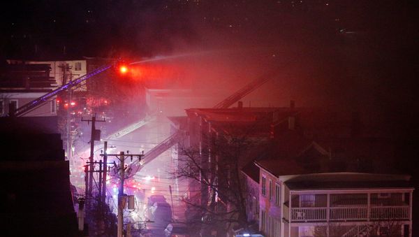 Firefighters battle a multi-alarm fire in a residential area of Cambridge, Massachusetts, U.S., December 3, 2016. - Sputnik International