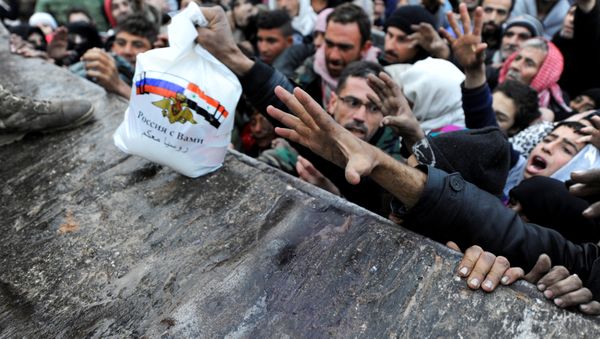 Syrians who have been evacuated from eastern Aleppo, reach out for Russian food aid in government-controlled Jibreen area in Aleppo, Syria November 30, 2016 Syrians who have been evacuated from eastern Aleppo, reach out for Russian food aid in government-controlled Jibreen area in Aleppo, Syria November 30, 2016 - Sputnik International