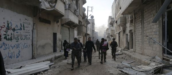 Syrian army soldiers help a family fleeing rebel-held eastern neighborhoods of Aleppo into the Tariq Al Bab area that is controlled by Syrian government forces East of Aleppo, Syria, Saturday, Dec. 3, 2016 - Sputnik International