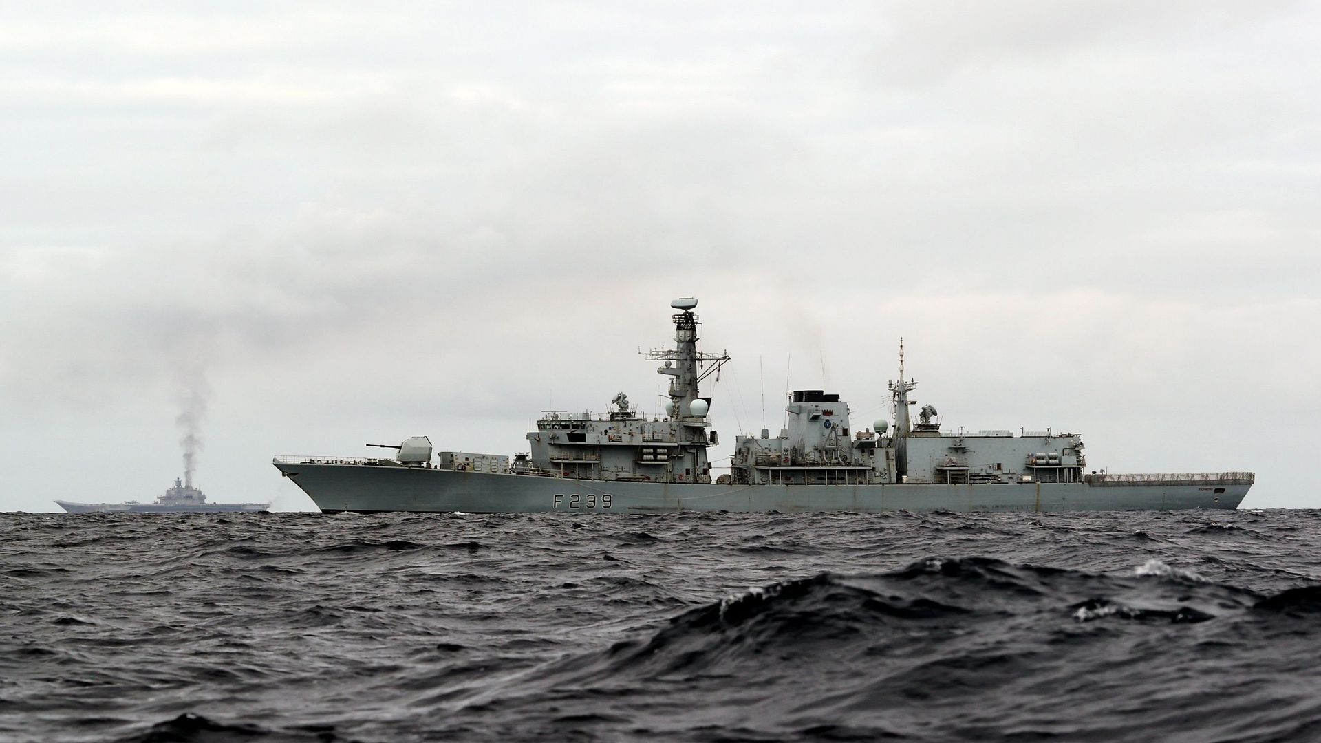 This is a handout photo issued by Britain's Ministry of Defence taken on Wednesday Oct. 19, 2016, of HMS Richmond, foreground, a Type 23 Duke Class frigate, observing aircraft carrier Admiral Kuznetsov, at rear left, which is part of a Russian task group, during transit through the North Sea This is a handout photo issued by Britain's Ministry of Defence taken on Wednesday Oct. 19, 2016, of HMS Richmond, foreground, a Type 23 Duke Class frigate, observing aircraft carrier Admiral Kuznetsov, at rear left, which is part of a Russian task group, during transit through the North Sea - Sputnik International, 1920, 27.09.2021
