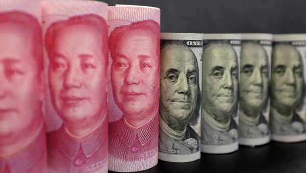 US 100 dollar banknotes and Chinese 100 yuan banknotes are seen in this picture illustration in Beijing, China, January 21, 2016.  - Sputnik International