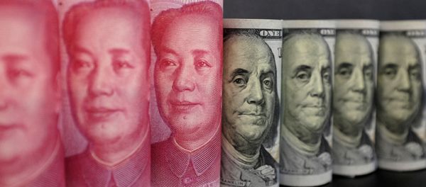 US 100 dollar banknotes and Chinese 100 yuan banknotes are seen in this picture illustration in Beijing, China, January 21, 2016. - Sputnik International
