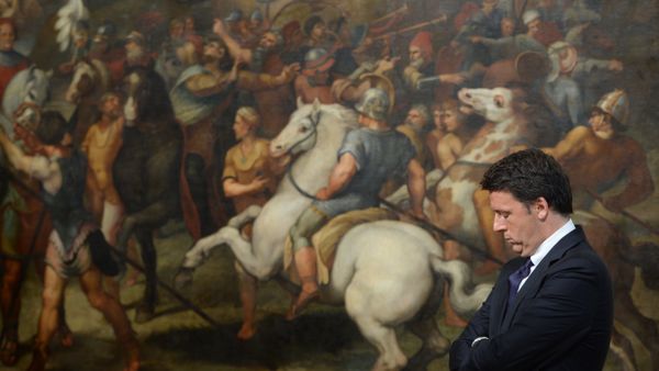 (FILES) This file photo taken on June 23, 2016 shows Italian Prime Minister Matteo Renzi standing in front of a copy of a fresco by Italian artist Raphael named The Meeting of Leo I and Attila, on June 23, 2016 at the Palazzo Chigi in Rome - Sputnik International