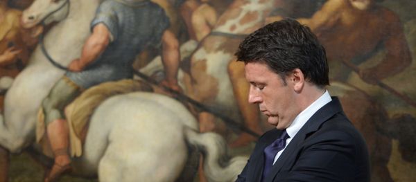 (FILES) This file photo taken on June 23, 2016 shows Italian Prime Minister Matteo Renzi standing in front of a copy of a fresco by Italian artist Raphael named The Meeting of Leo I and Attila, on June 23, 2016 at the Palazzo Chigi in Rome (FILES) This file photo taken on June 23, 2016 shows Italian Prime Minister Matteo Renzi standing in front of a copy of a fresco by Italian artist Raphael named The Meeting of Leo I and Attila, on June 23, 2016 at the Palazzo Chigi in Rome - Sputnik International