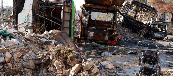 An abandoned child stroller is seen near damaged vehicles which were used as barricades in Hanano housing district after government forces took control of the area in Aleppo, Syria December 2, 2016. An abandoned child stroller is seen near damaged vehicles which were used as barricades in Hanano housing district after government forces took control of the area in Aleppo, Syria December 2, 2016. - Sputnik International