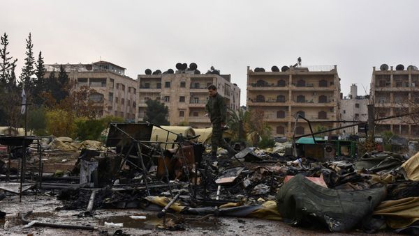 A Russian soldier inspects the damage at a Russian military field hospital after it was shelled by what the Russian Defence Ministry said were Syrian rebels in Aleppo, Syria, in this handout picture provided by SANA on December 5, 2016. - Sputnik International