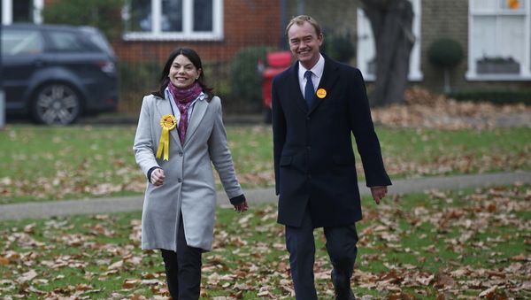 Liberal Democrats winner of the Richmond Park by-election, Sarah Olney, arrives to celebrate her victory with party leader Tim Farron (R) on Richmond Green in London, Britain December 2, 2016. Liberal Democrats winner of the Richmond Park by-election, Sarah Olney, arrives to celebrate her victory with party leader Tim Farron (R) on Richmond Green in London, Britain December 2, 2016. - Sputnik International