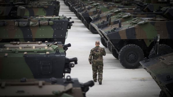 A man walks among VBCI armored vehicles on June 9, 2015 at Mourmelon military camp, northeastern France - Sputnik International