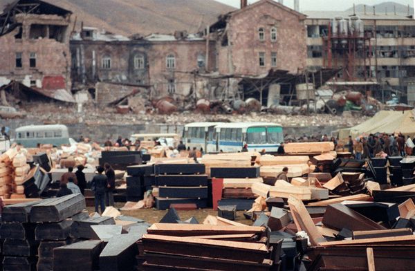 Coffins are piled up in the devastated town of Spitak, on December 12, 1988, after an earthquake hit Armenia, on December 7, 1988. (File) - Sputnik International