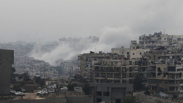 Smoke rises after rebel fighters launch a mortar shell on a residential neighborhood in western Aleppo, Syria - Sputnik International